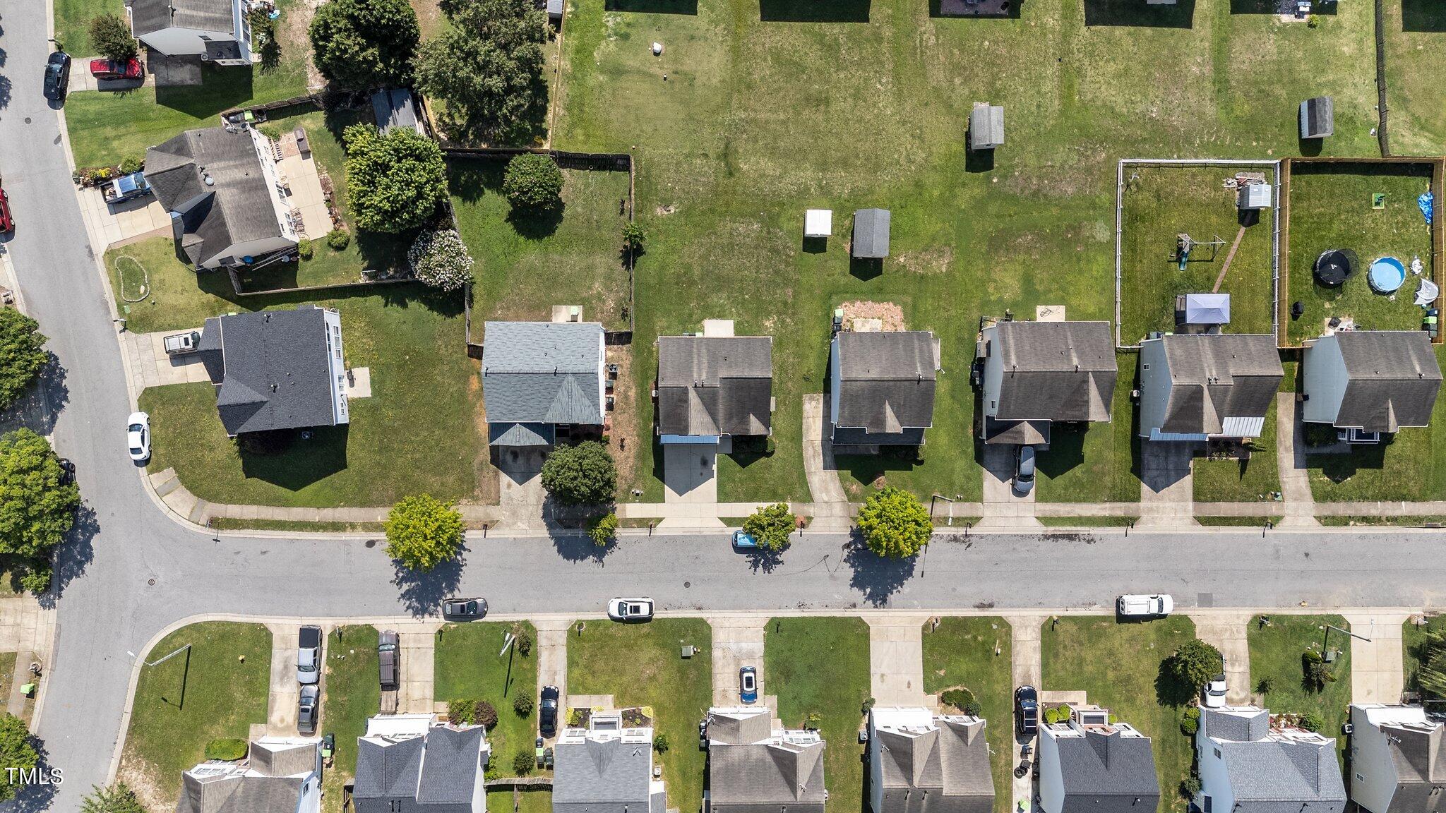 2909 Hayling Drive Raleigh, NC 27610 - Photo 32 of 35 an aerial view of multiple houses with a street