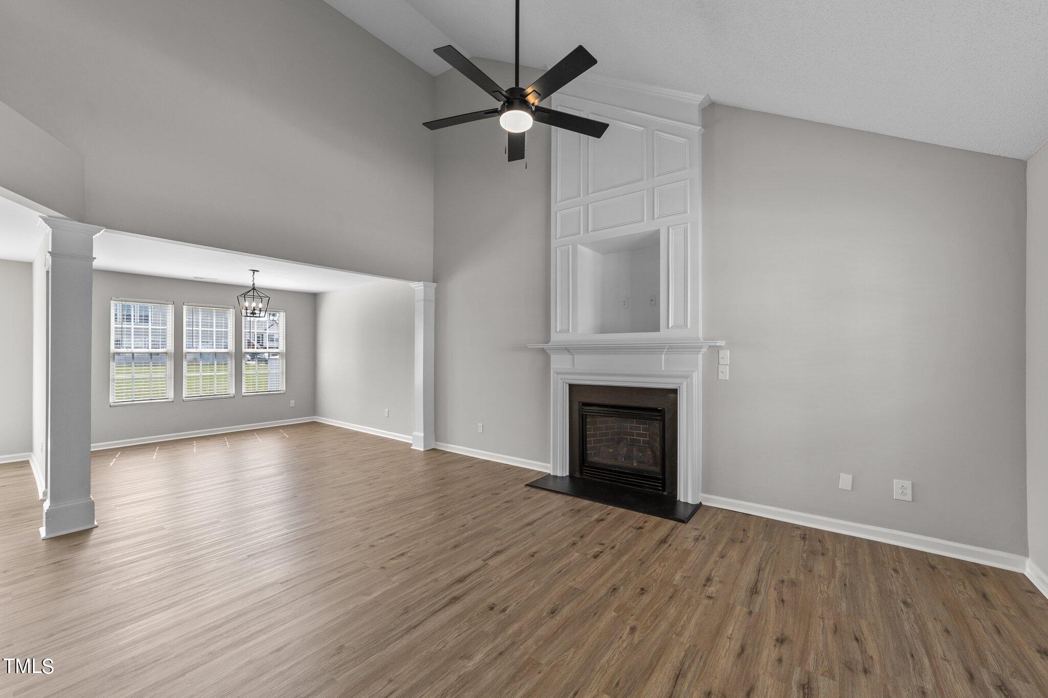 2909 Hayling Drive Raleigh, NC 27610 - Photo 6 of 35 wooden floor in an empty room with a window