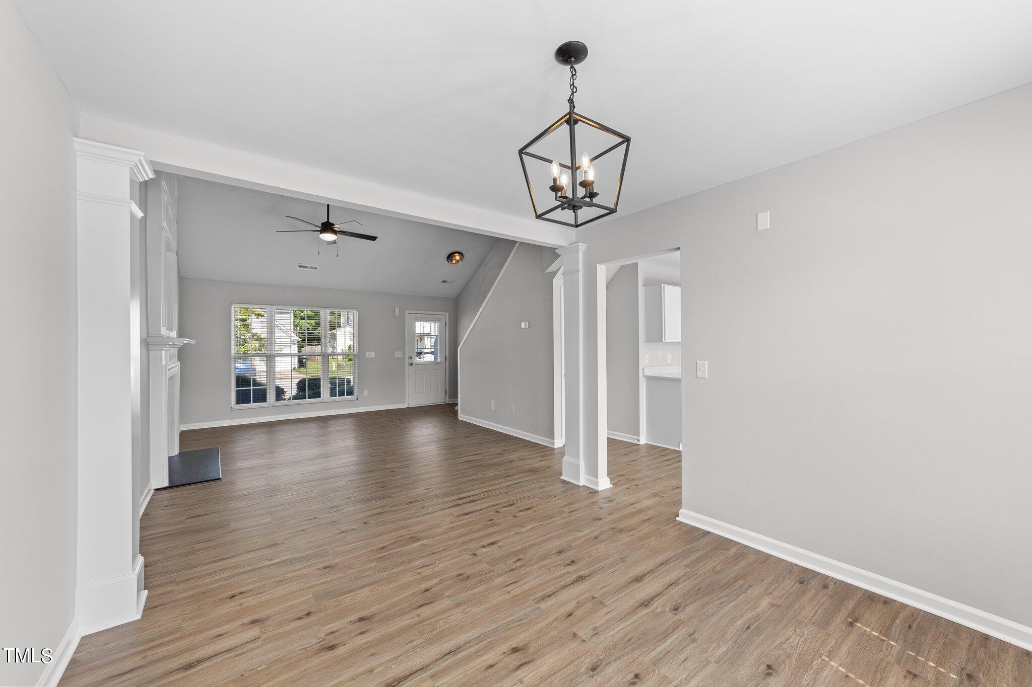 2909 Hayling Drive Raleigh, NC 27610 - Photo 8 of 35 a view of a room with wooden floor and ceiling fan