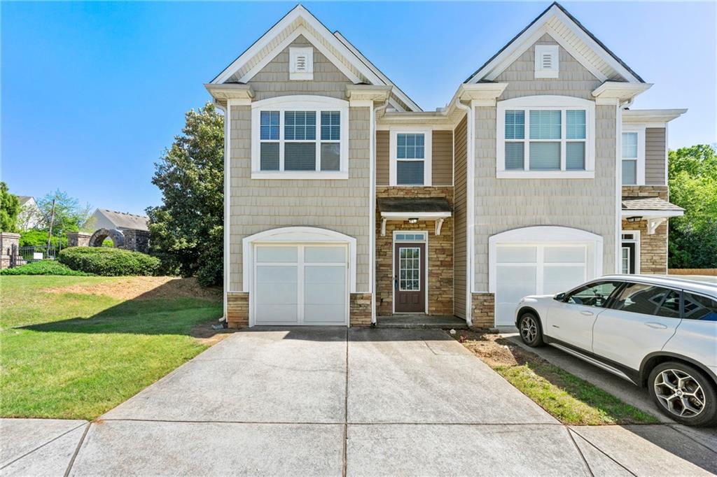 2060 Executive Drive Duluth, GA 30096 - Photo 1 of 1 a front view of a house with garden