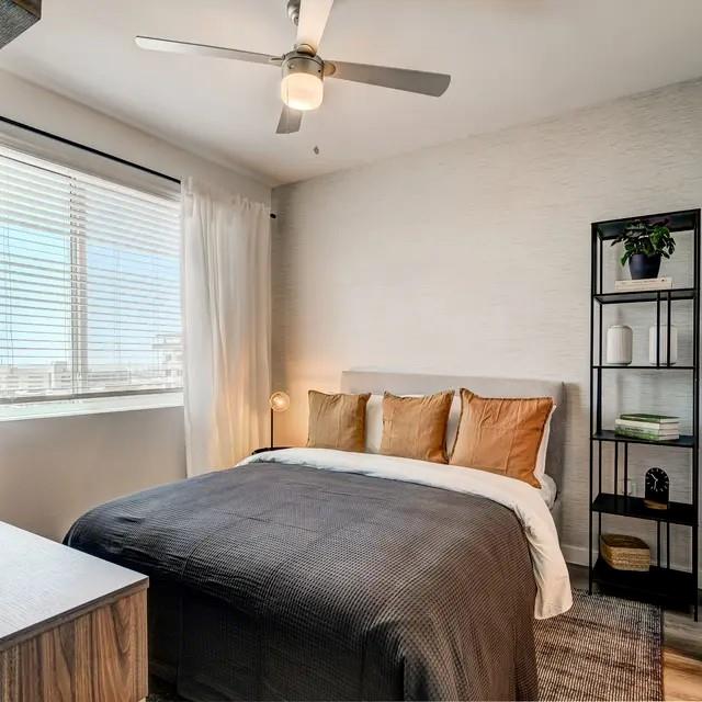 3130 Heritage Trail, Unit 1119 Denton, TX 76201 - Photo 21 of 39 Bedroom with a ceiling fan and wood finished floors
