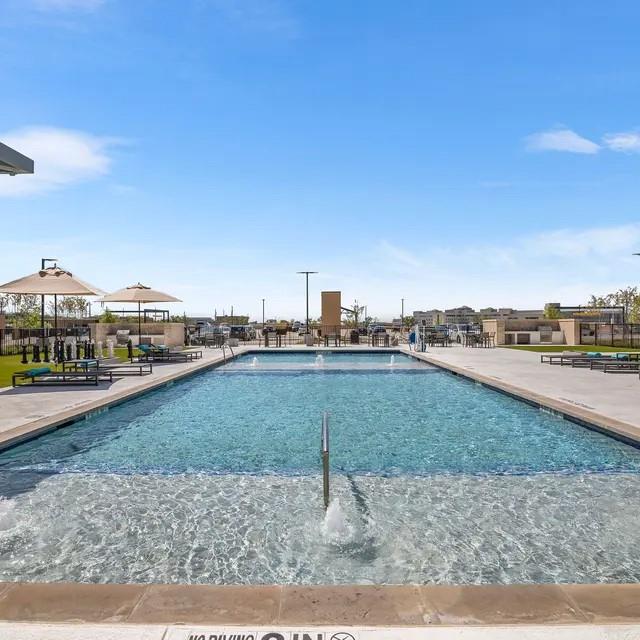 3130 Heritage Trail, Unit 1119 Denton, TX 76201 - Photo 3 of 39 Community pool featuring a patio area