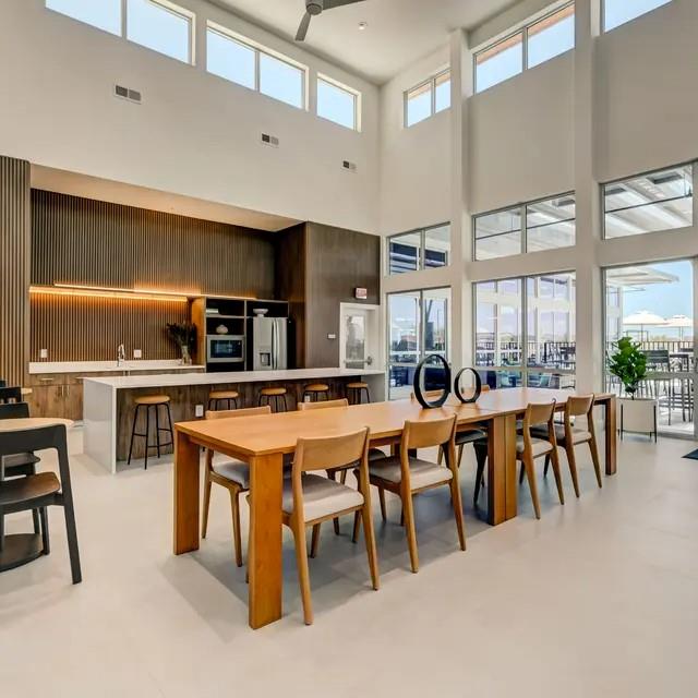 3130 Heritage Trail, Unit 1119 Denton, TX 76201 - Photo 7 of 39 Dining room with a high ceiling and wood walls