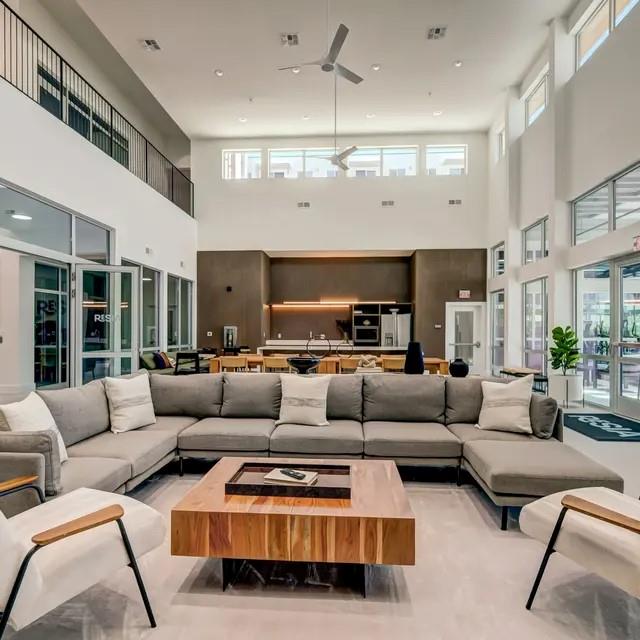 3130 Heritage Trail, Unit 1119 Denton, TX 76201 - Photo 8 of 39 Living area featuring ceiling fan and a high ceiling