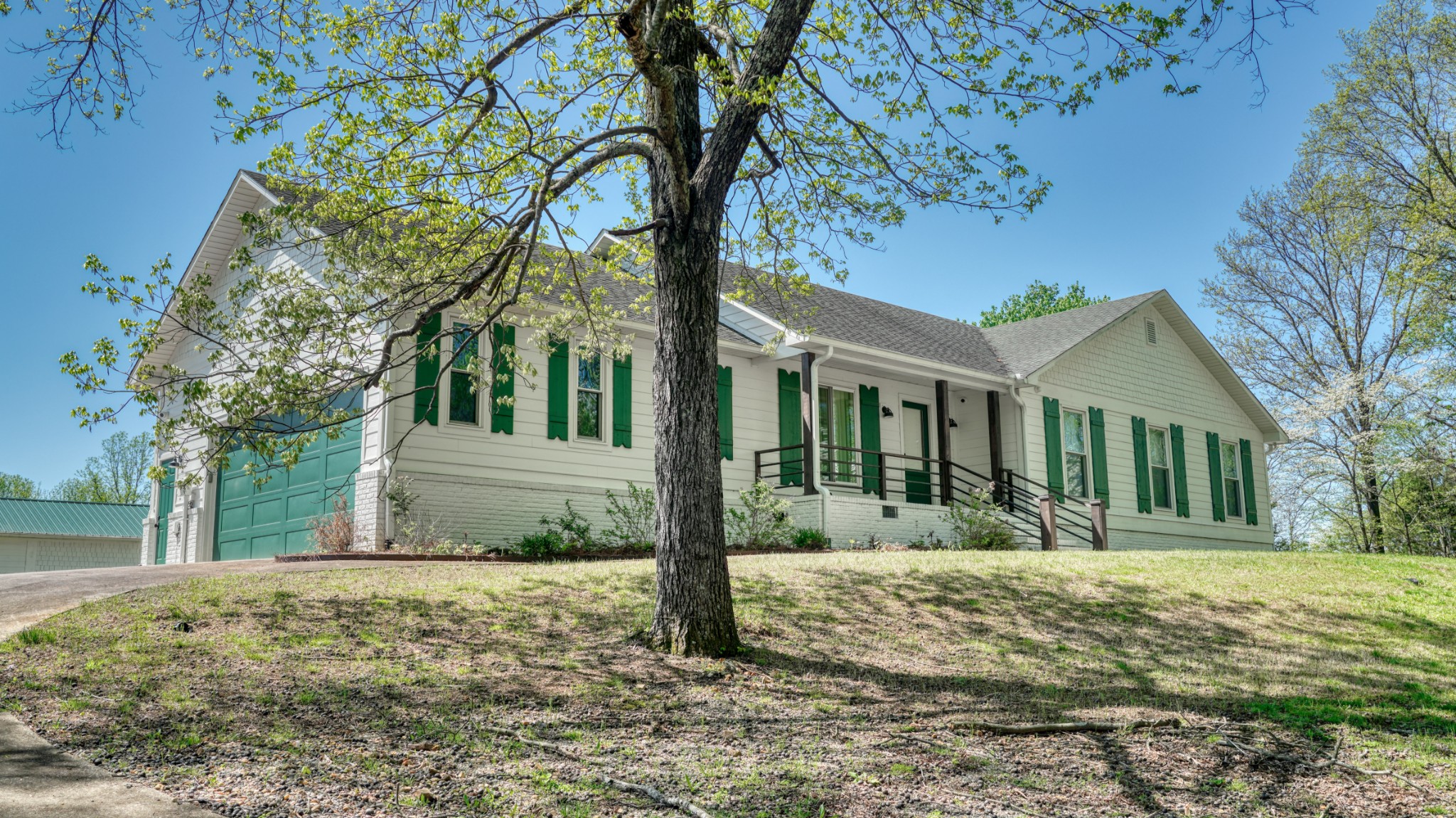 560 Big Spring Hollow Road Pulaski, TN 38478 - Photo 1 of 41 a front view of a house with a yard