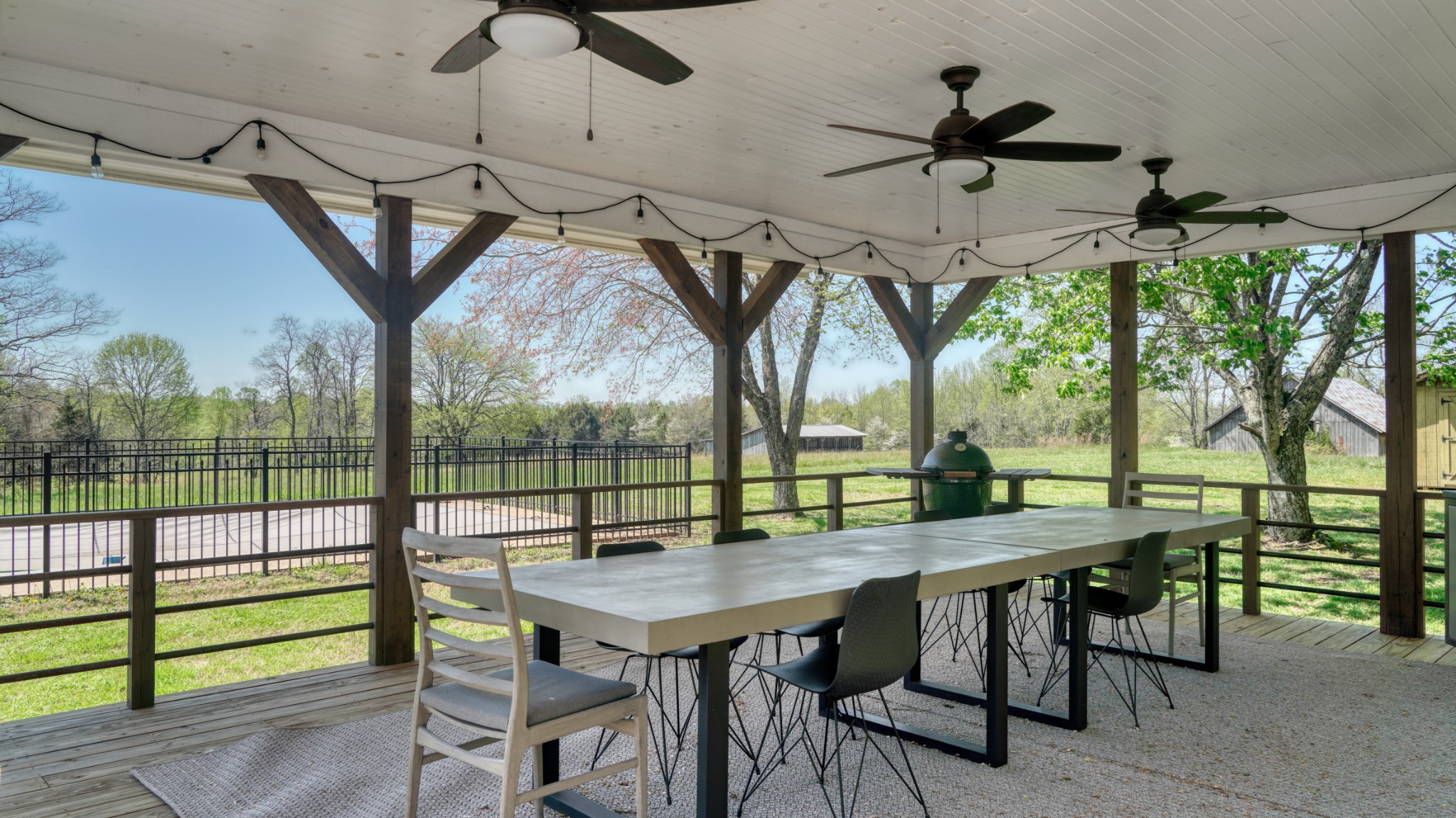 560 Big Spring Hollow Road Pulaski, TN 38478 - Photo 31 of 41 a view of a dining table and chairs in the patio