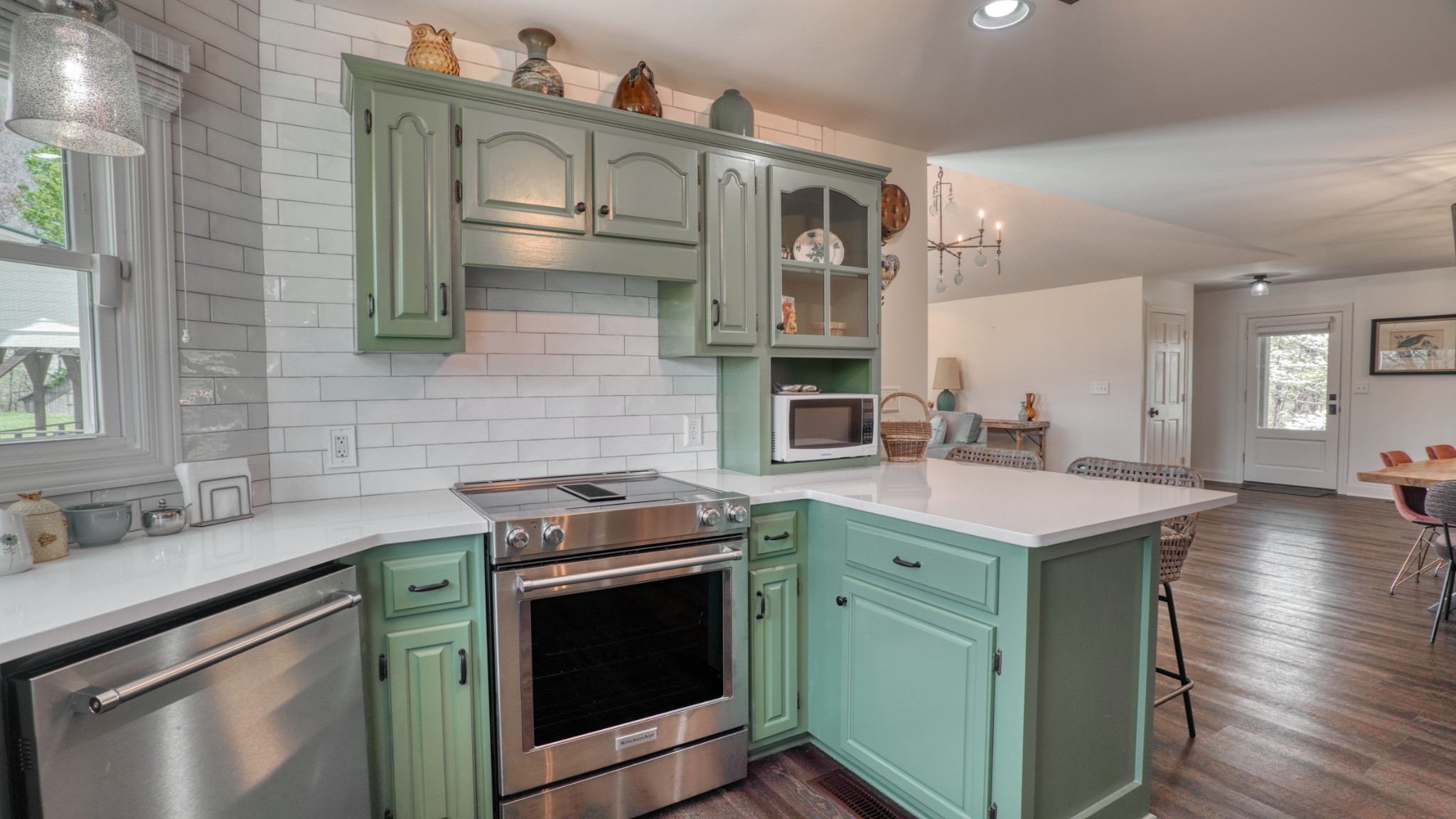 560 Big Spring Hollow Road Pulaski, TN 38478 - Photo 8 of 41 a kitchen with stainless steel appliances granite countertop a stove a sink and a microwave