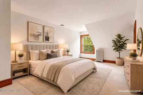 a view of wooden floor and windows in a room