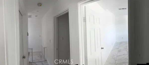 a bathroom with a shower and a glass door