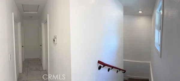 a view of a hallway with a door