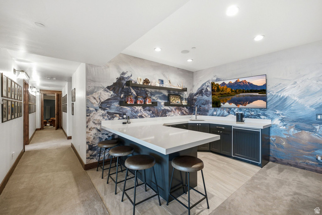 7885 North Rabbitbrush Court, Unit 13 Park City, UT 84098 - Photo 42 of 88 Entertainment area featuring a spacious L-shaped counter with seating, a built-in sink, and custom cabinetry