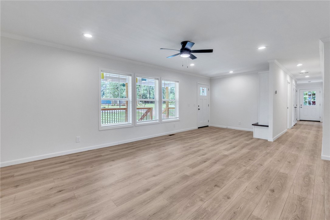 108 Old River Road Iva, SC 29655 - Photo 4 of 31 A spacious living area with light wood flooring and multiple windows invites abundant natural illumination.