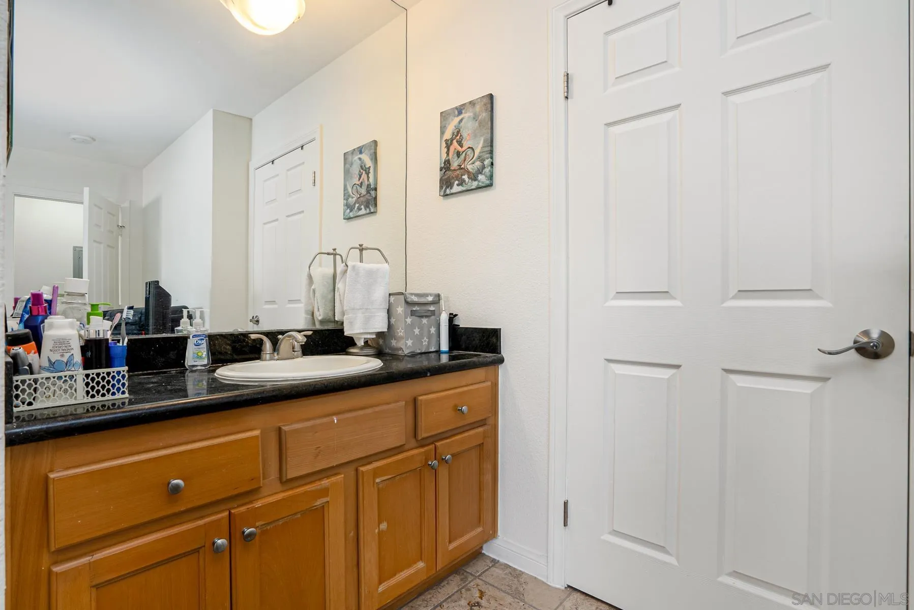 9860 Dale Avenue, Unit D7 Spring Valley, CA 91977 - Photo 14 of 19 a close view of a sink and a mirror