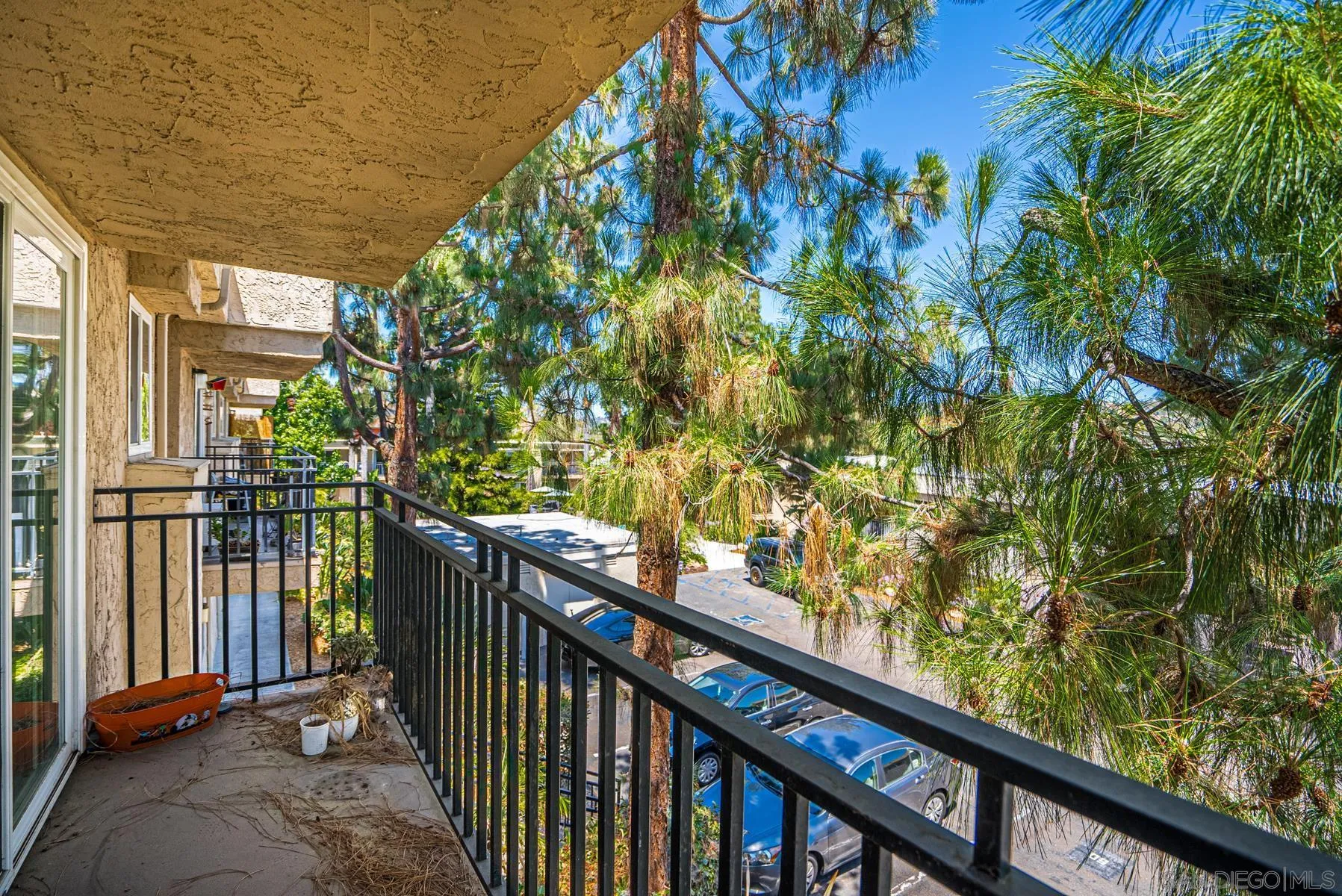 9860 Dale Avenue, Unit D7 Spring Valley, CA 91977 - Photo 17 of 19 a view of balcony with wooden floor and fence