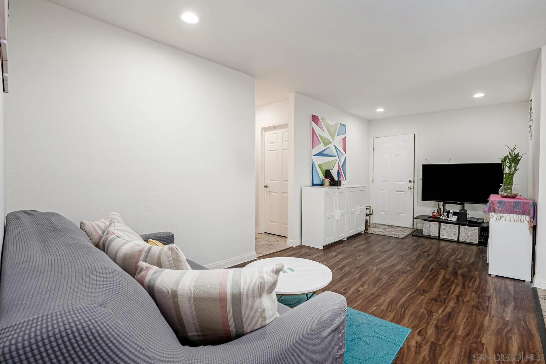 9860 Dale Avenue, Unit D7 Spring Valley, CA 91977 - Photo 5 of 19 a living room with furniture and a flat screen tv