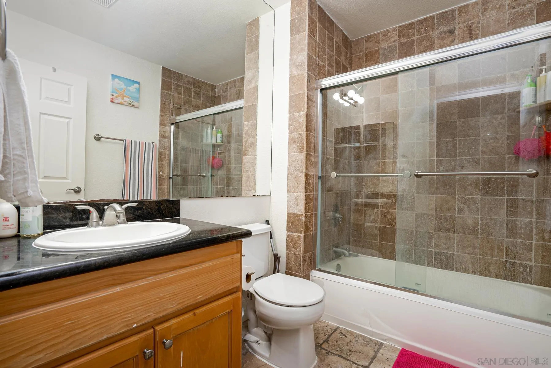 9860 Dale Avenue, Unit D7 Spring Valley, CA 91977 - Photo 9 of 19 a bathroom with a sink a toilet and shower