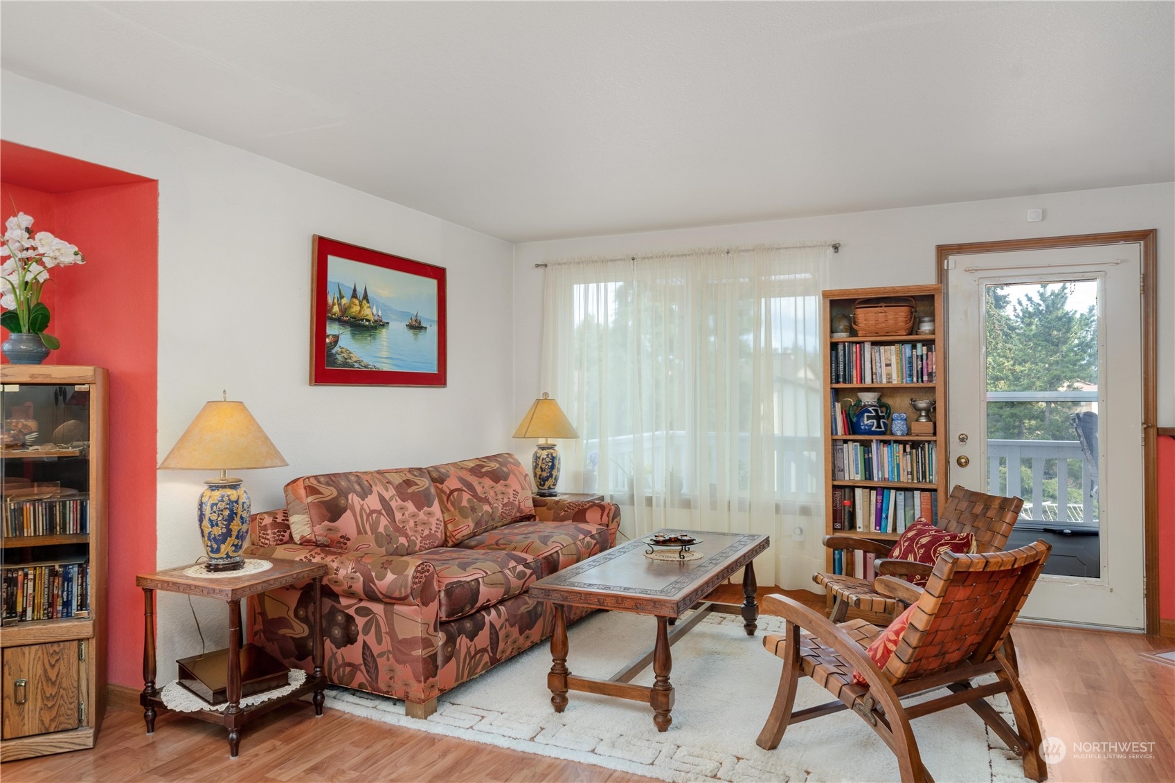 925 South 310th Place Federal Way, WA 98003 - Photo 17 of 39 a living room with furniture a bookshelf and a window