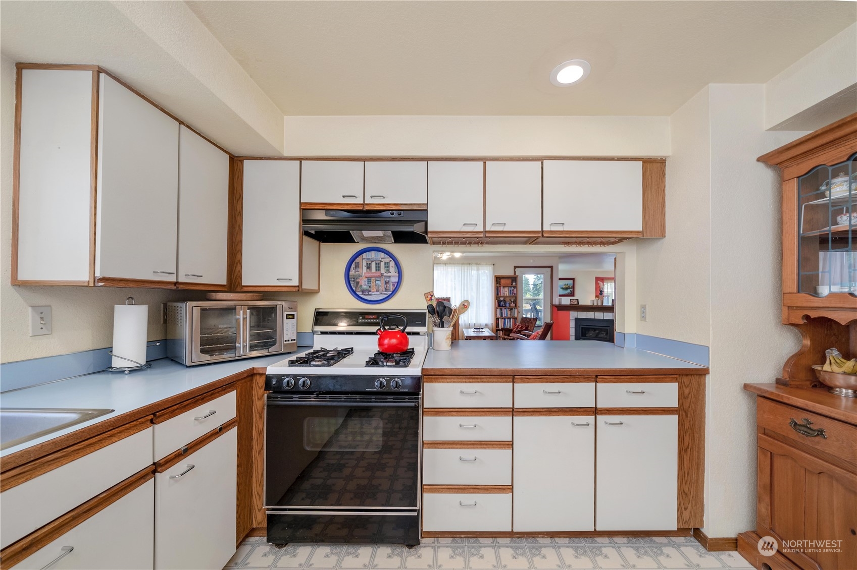 925 South 310th Place Federal Way, WA 98003 - Photo 24 of 39 a kitchen with stainless steel appliances granite countertop a stove and cabinets