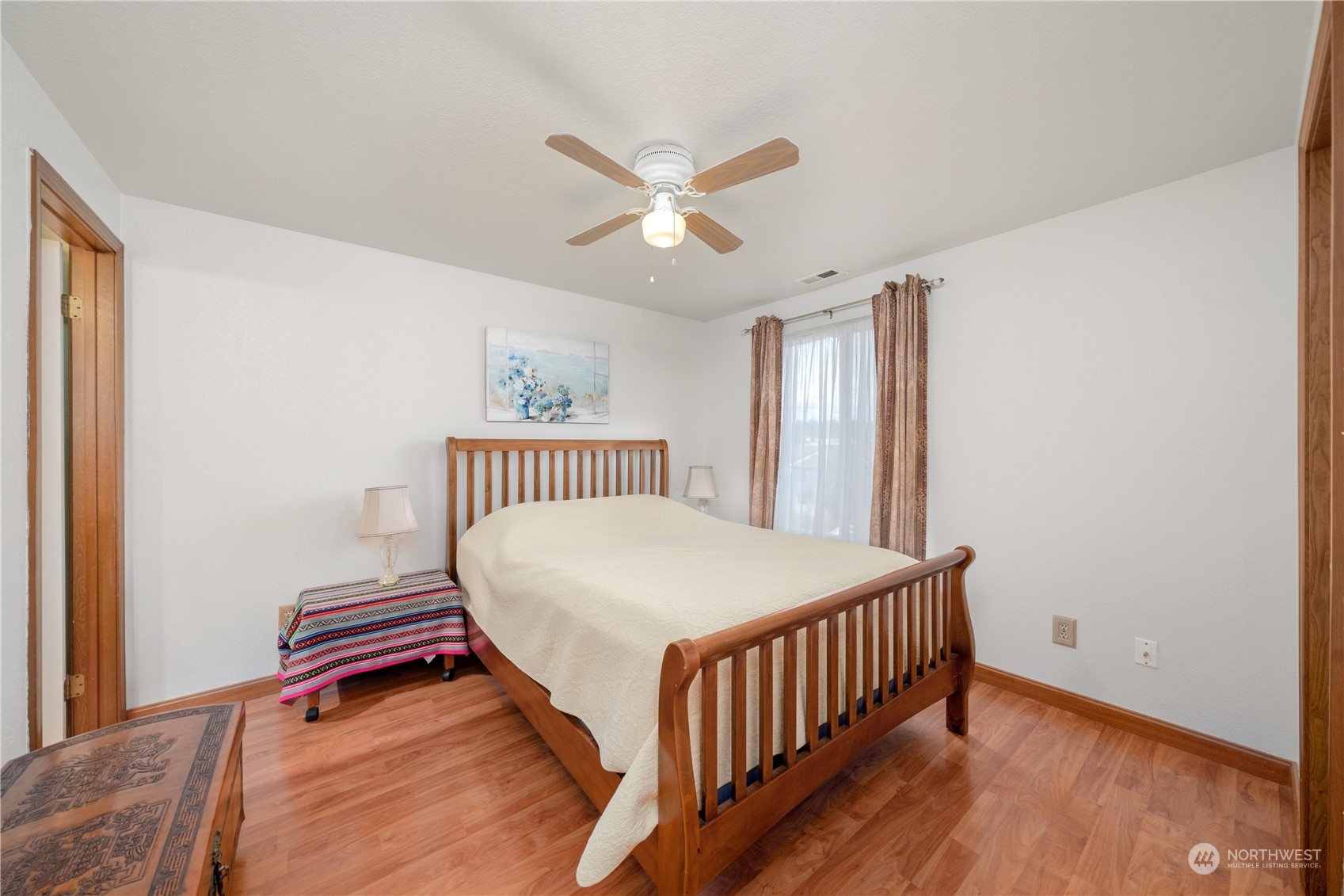 925 South 310th Place Federal Way, WA 98003 - Photo 29 of 39 a bedroom with a bed and a chandelier