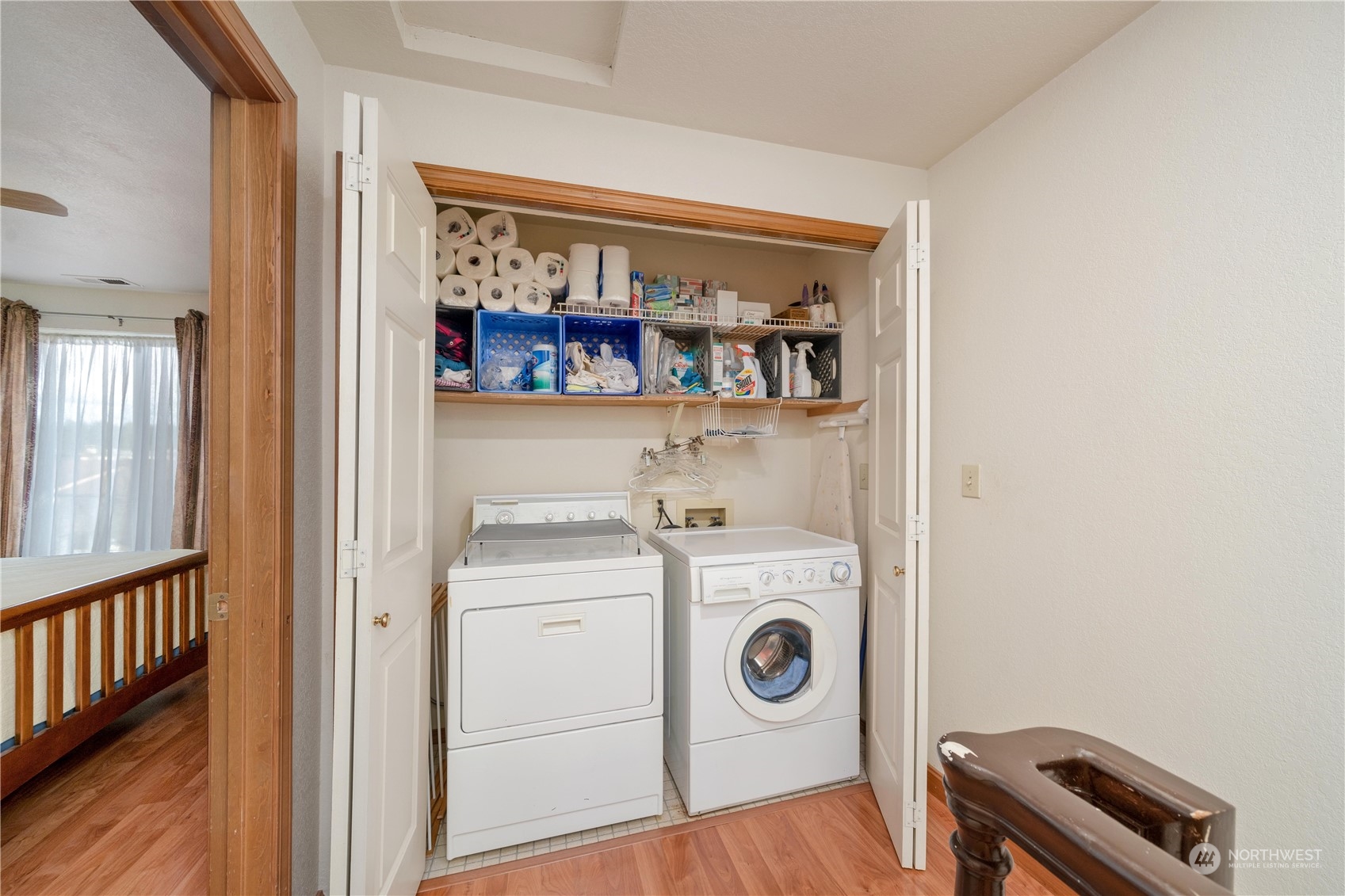 925 South 310th Place Federal Way, WA 98003 - Photo 30 of 39 a view of washer and dryer with wooden floor