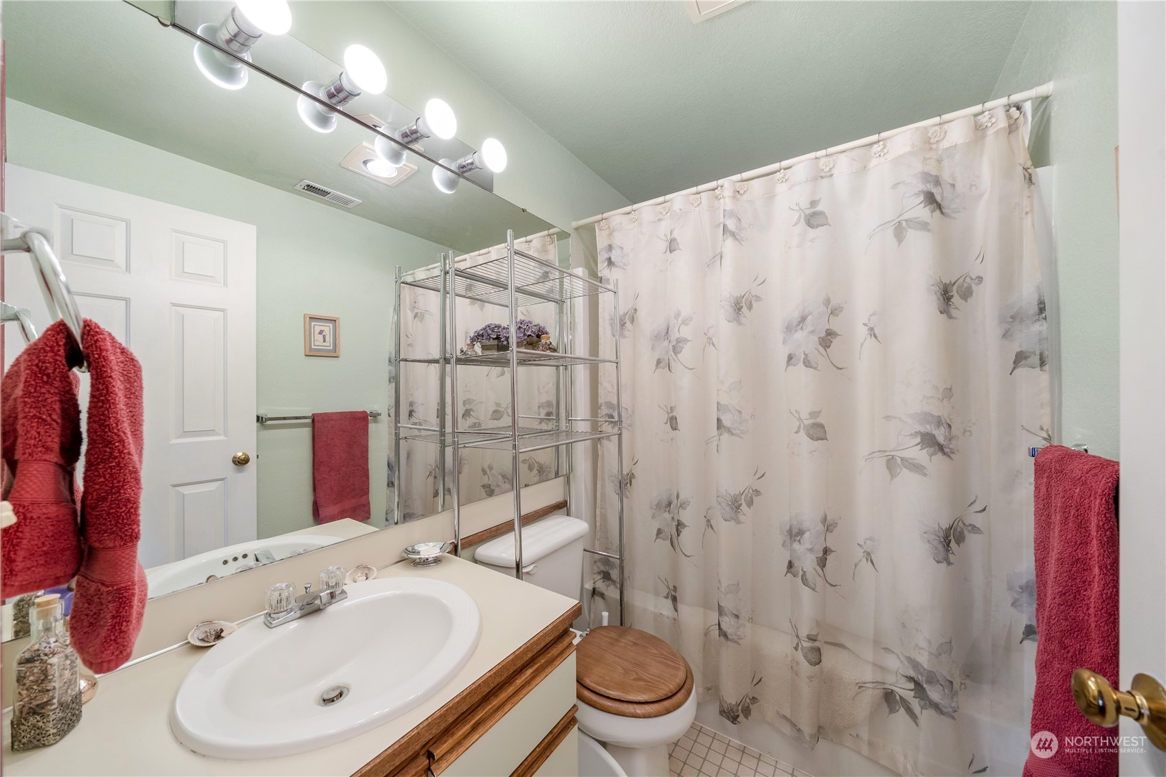925 South 310th Place Federal Way, WA 98003 - Photo 34 of 39 a bathroom with a sink vanity mirror and toilet