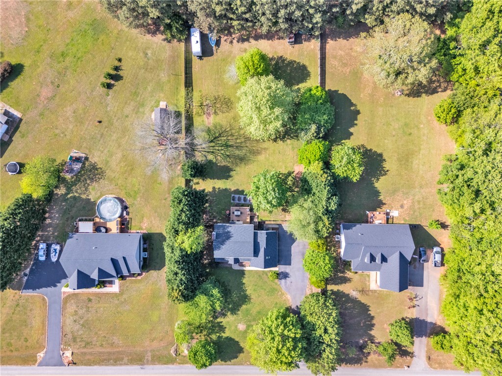 154 Hammond School Road Anderson, SC 29621 - Photo 30 of 33 An aerial view captures the expansive landscape with multiple properties and lush greenery.
