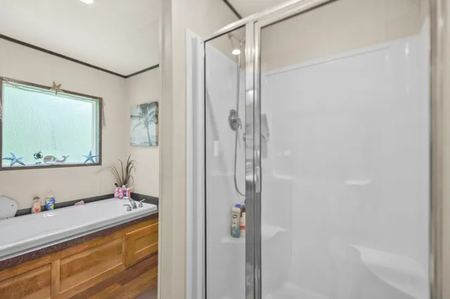 a bathroom with a tub and a sink