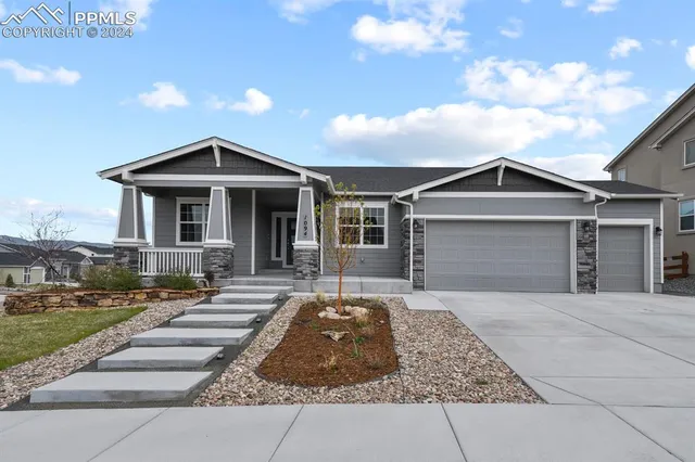 a front view of a house with yard