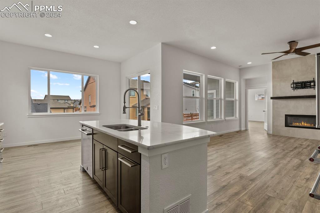 1094 Rambling Oak Drive Monument, CO 80132 - Photo 13 of 44 a kitchen with stainless steel appliances granite countertop a sink stove and refrigerator