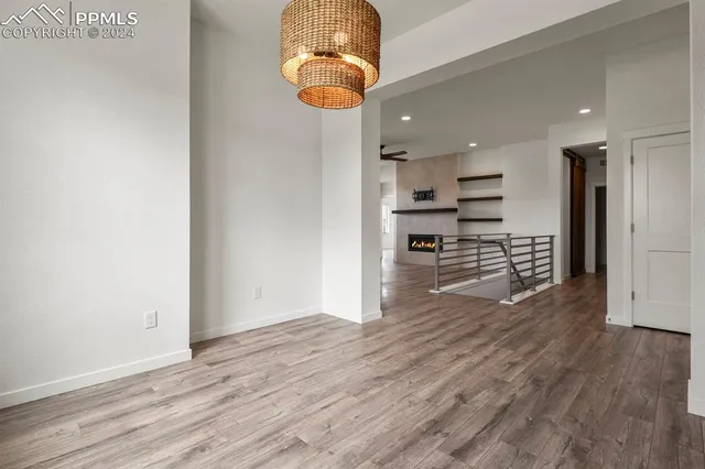 a view of a kitchen with wooden floor