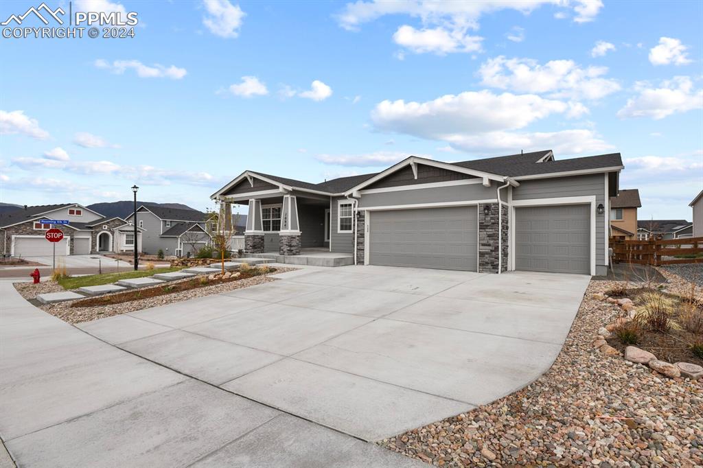 1094 Rambling Oak Drive Monument, CO 80132 - Photo 2 of 44 a view of a white house with a sink and yard
