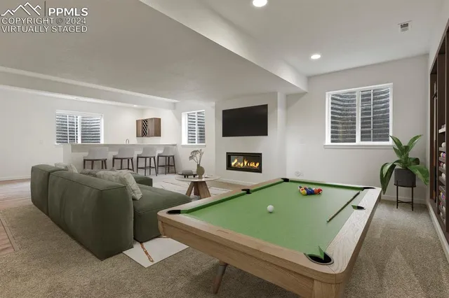 a room with furniture and a flat screen tv