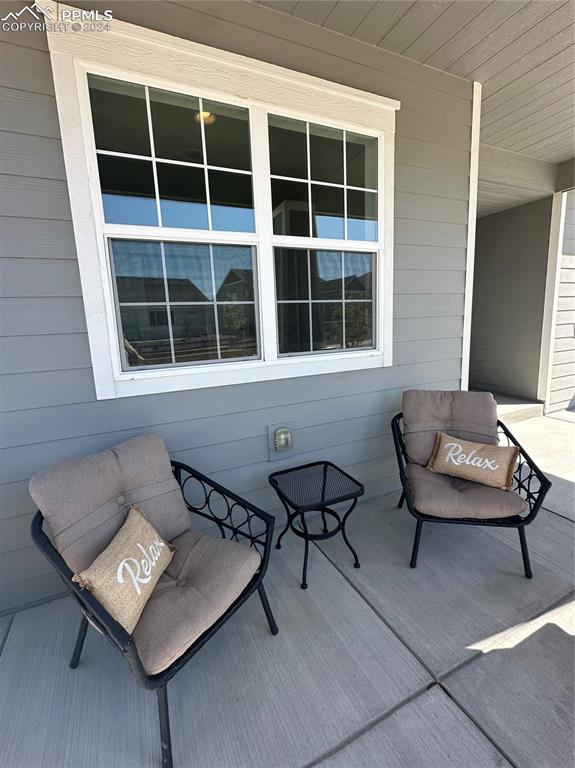 1094 Rambling Oak Drive Monument, CO 80132 - Photo 4 of 44 a view of a two chairs in a room