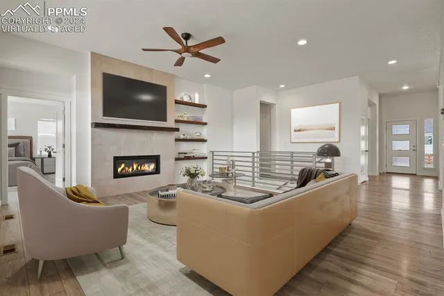 a living room with furniture and a fireplace