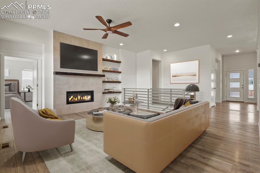 1094 Rambling Oak Drive Monument, CO 80132 - Photo 7 of 44 a living room with furniture and a fireplace