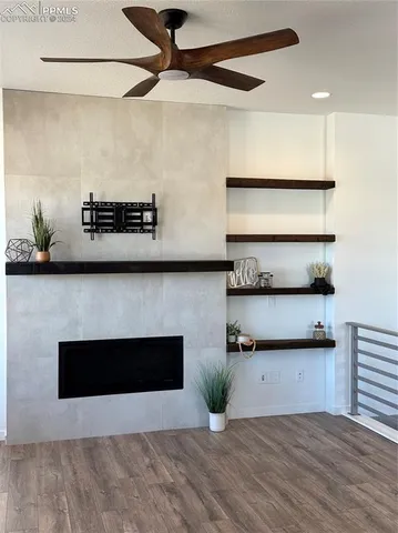 a kitchen with stainless steel appliances granite countertop a stove a microwave and a refrigerator