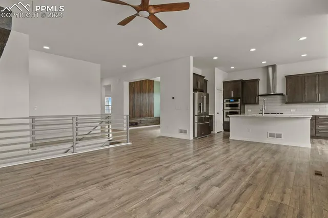 a view of kitchen with cabinets and stainless steel appliances