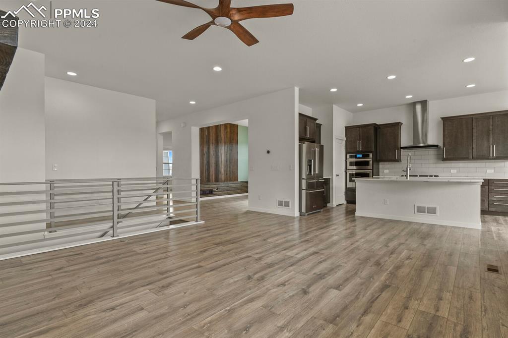 1094 Rambling Oak Drive Monument, CO 80132 - Photo 10 of 44 a view of kitchen with cabinets and stainless steel appliances