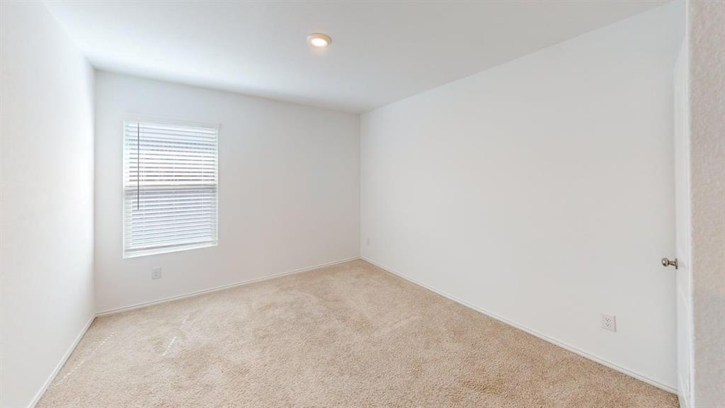 3801 Harper Street Little Elm, TX 75068 - Photo 12 of 17 an empty room with a window