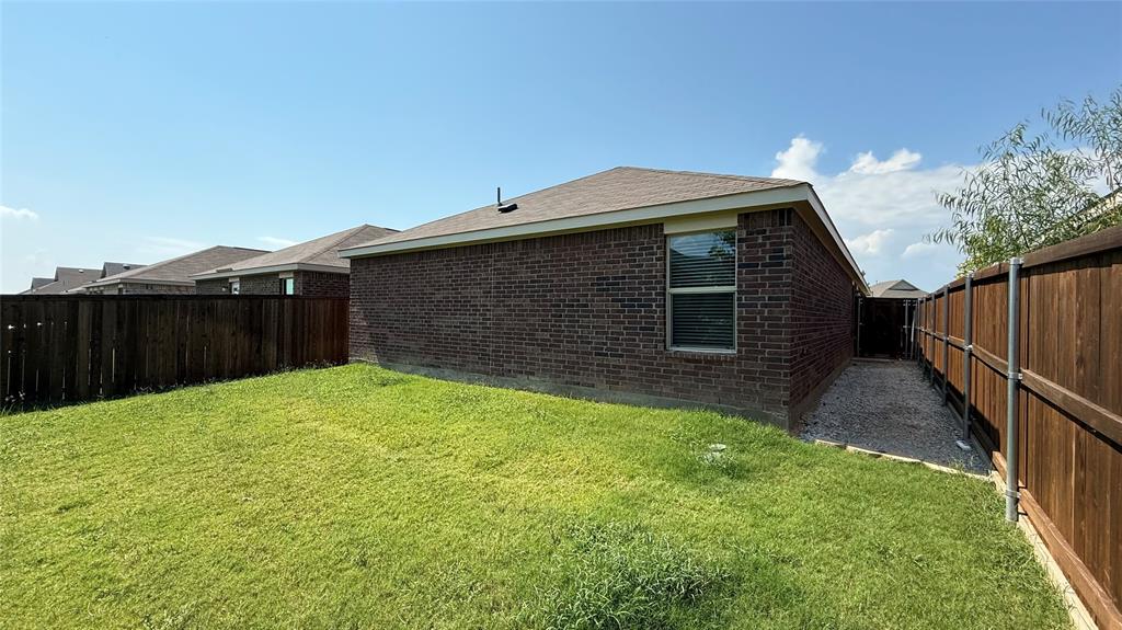 3801 Harper Street Little Elm, TX 75068 - Photo 17 of 17 a backyard of a house with lots of green space