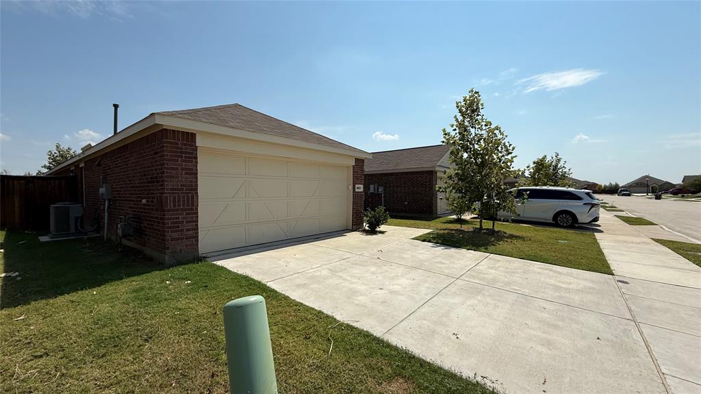 3801 Harper Street Little Elm, TX 75068 - Photo 2 of 17 a house view with a garden space