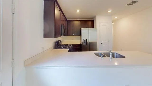 a bathroom with a sink a large mirror and a shower