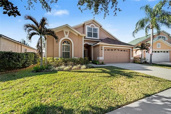 a view of a hallway with dining area chandelier and livingroom view
