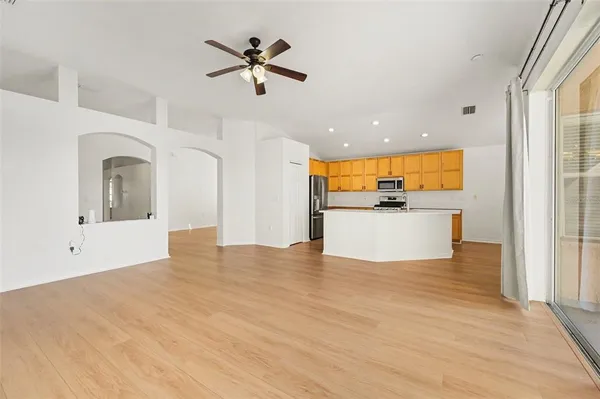 a view of a kitchen with a sink and a window