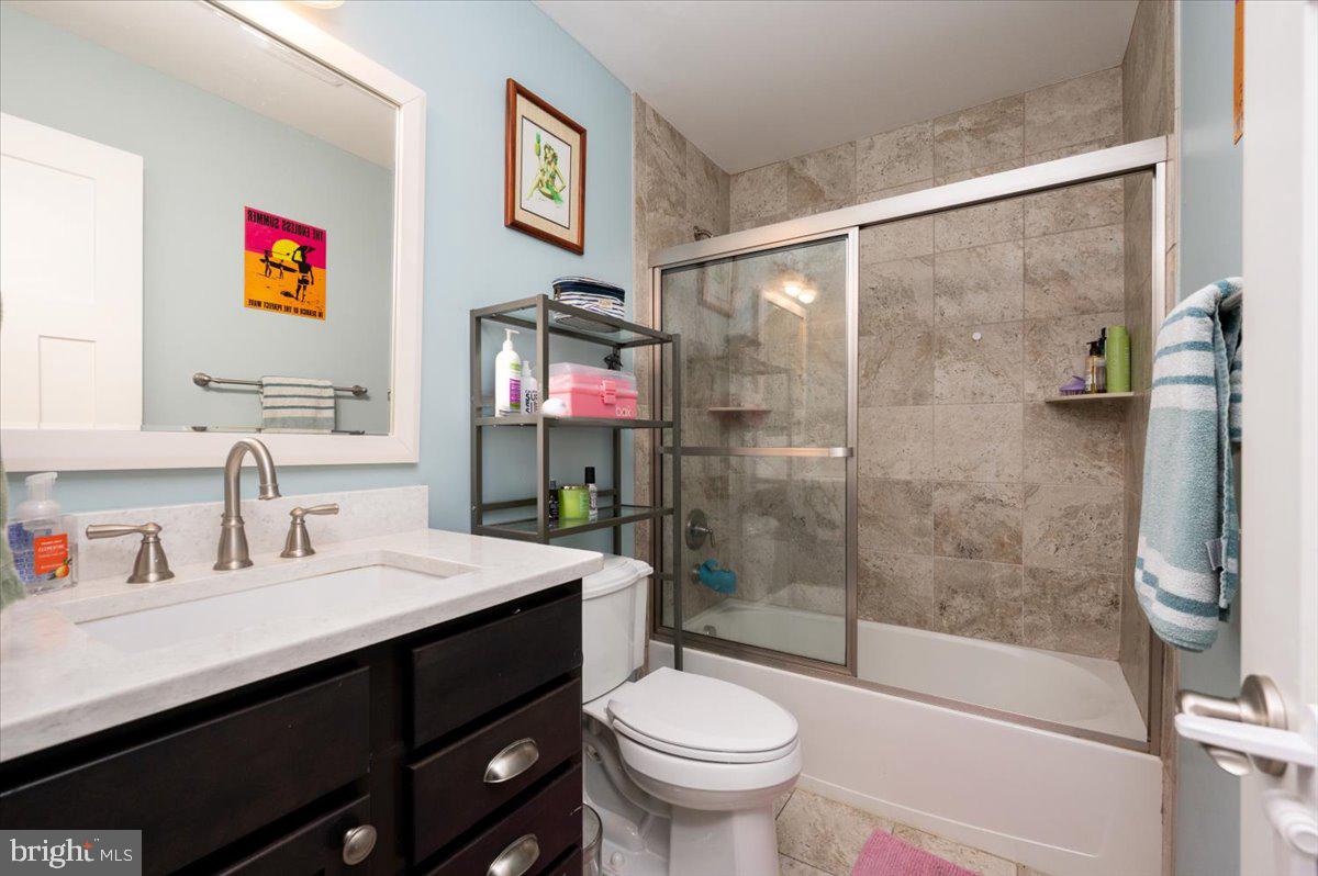 57 Spa Road Annapolis, MD 21401 - Photo 15 of 39 a bathroom with a sink a toilet and shower