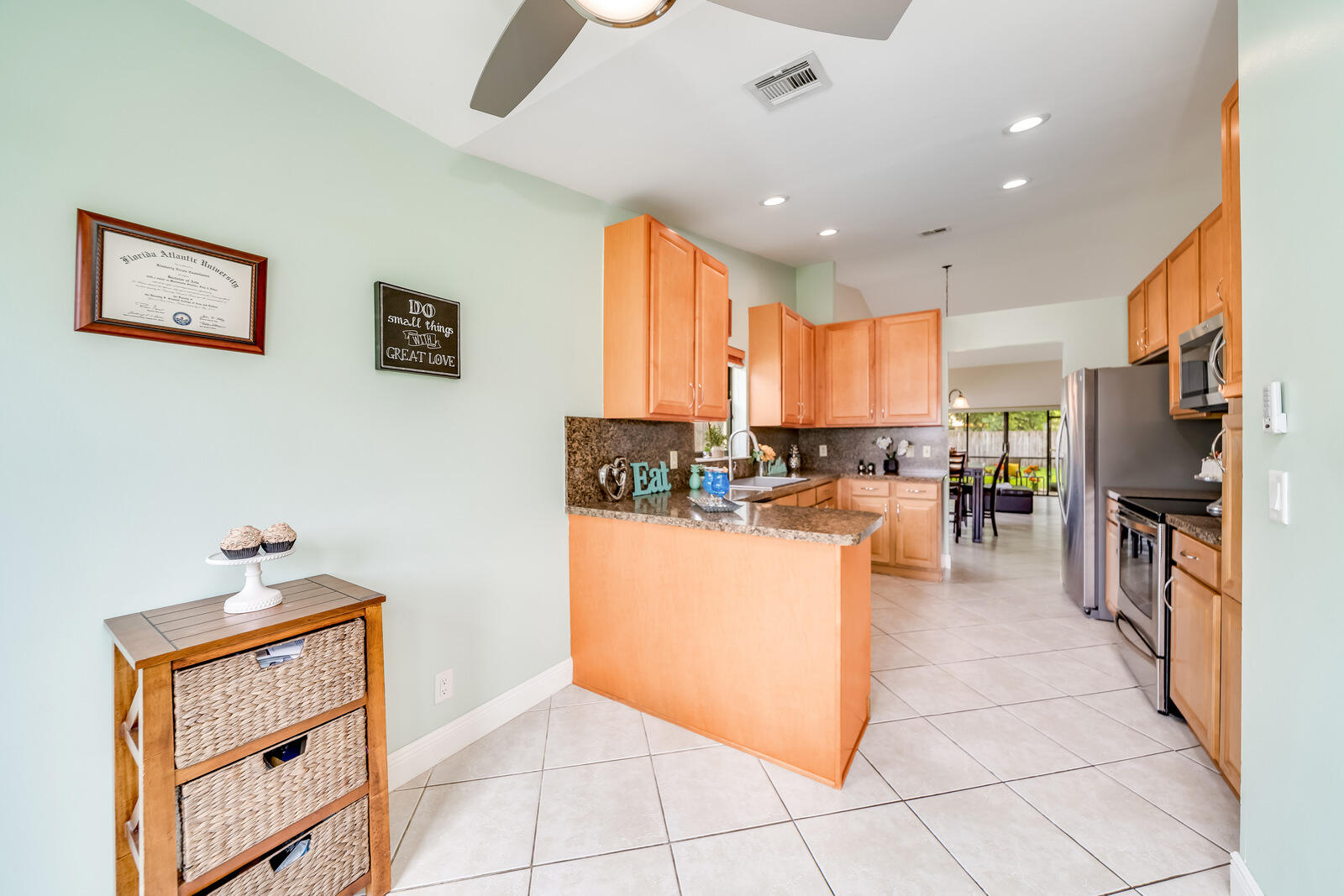 23250 Sedawie Drive Boca Raton, FL 33433 - Photo 16 of 42 a kitchen with stainless steel appliances granite countertop a refrigerator and a stove top oven