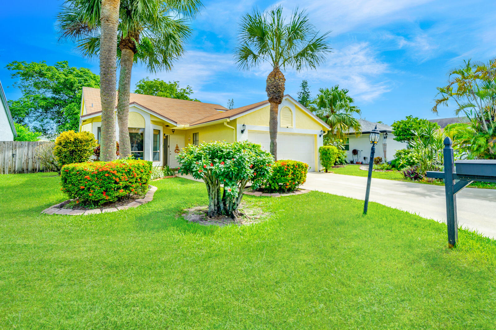 23250 Sedawie Drive Boca Raton, FL 33433 - Photo 2 of 42 a house that has a garden in front of it