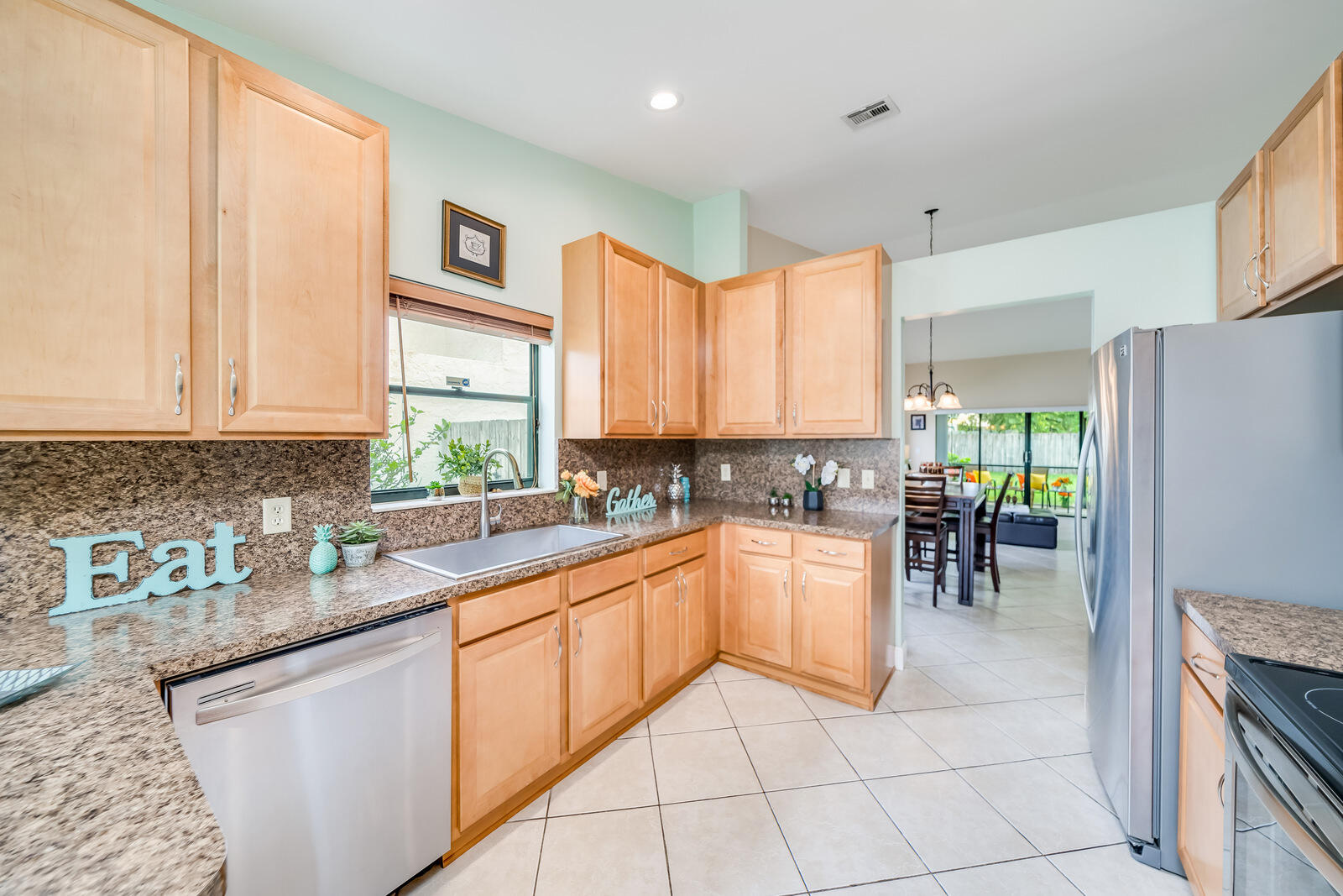 23250 Sedawie Drive Boca Raton, FL 33433 - Photo 21 of 42 a kitchen with a sink cabinets and window