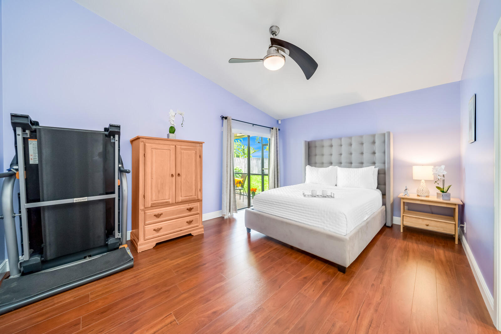 23250 Sedawie Drive Boca Raton, FL 33433 - Photo 23 of 42 a bedroom with a bed and a chandelier