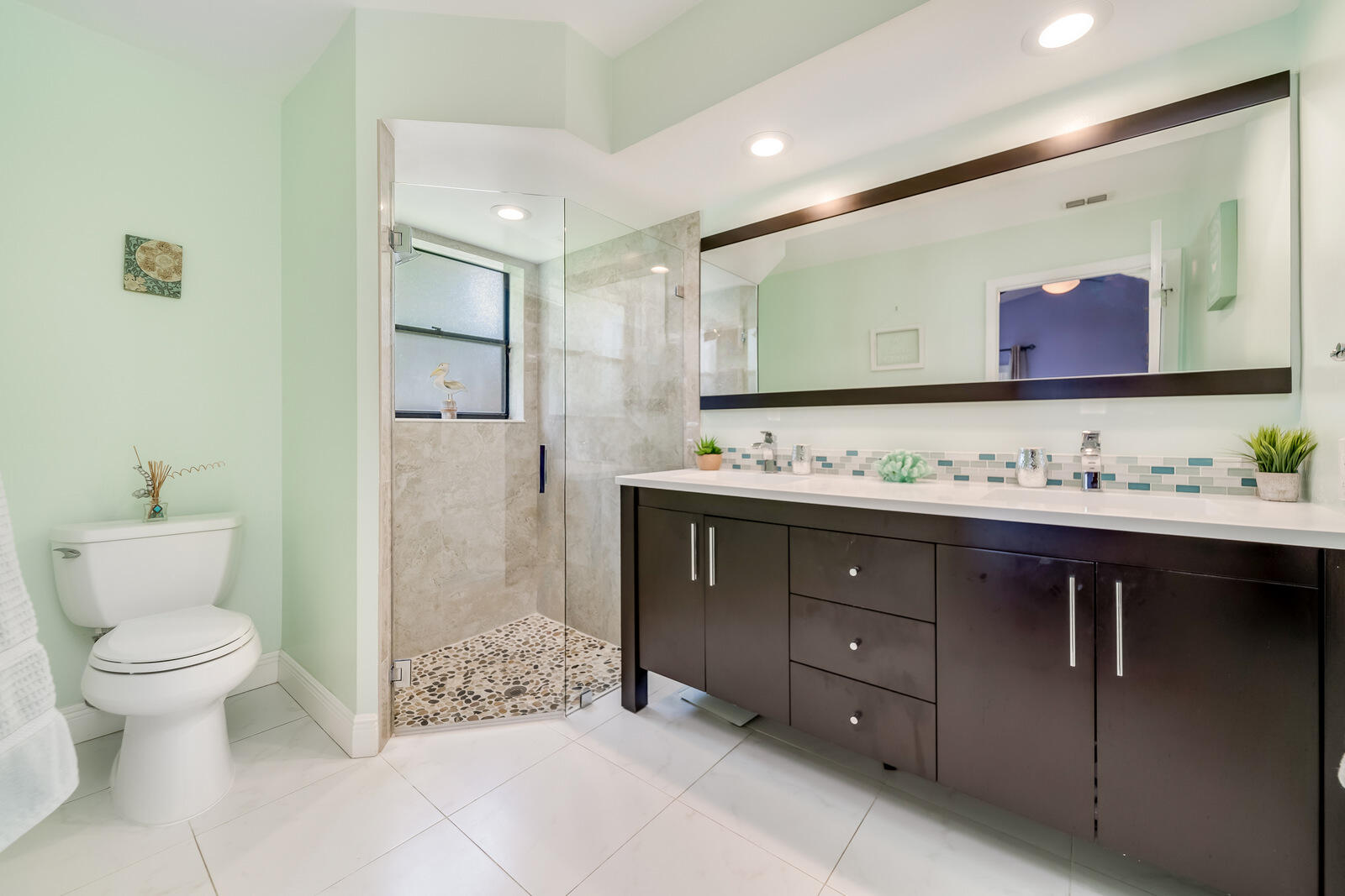 23250 Sedawie Drive Boca Raton, FL 33433 - Photo 26 of 42 a bathroom with a sink a toilet and a mirror